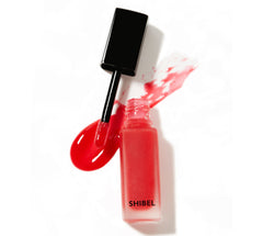 Swatch of Lip Embellish Gloss Balm in shade Attention